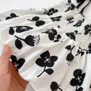 Summer toddler girl outfit with black flower print camisole top and elastic smocking