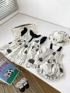 Three-piece baby girl summer set with floral romper, dress and matching sun hat
