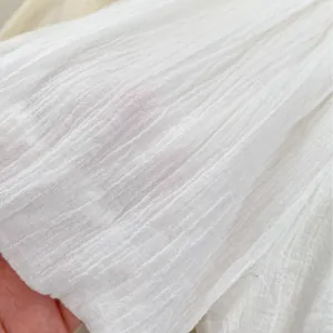 Close-up of white bubble lantern shorts fabric showing pleated texture and soft cotton material