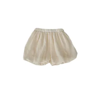 Girls summer cotton bubble shorts in beige featuring elastic high waist and puff design