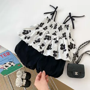 Detail of floral spaghetti strap top and cotton shorts set for toddler girls