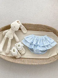 Floral baby girl ruffled bloomers with cream soft sole shoes and a plush bunny toy