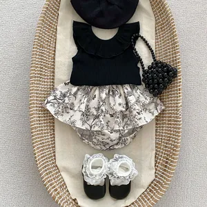 Infant girl ruffled sleeveless black top and floral layered shorts set with accessories