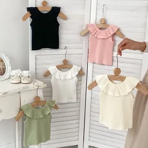 Girls ruffle sleeveless knit tank top available in five colors with rib texture design