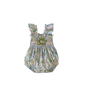 Barboteuse fleurie pour bébé fille avec volants et nœuds en velours vert sur jaune