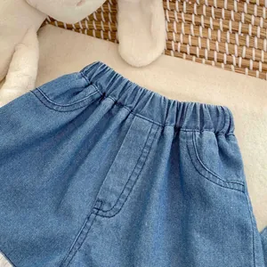Classic blue denim shorts for girls with elastic waistband and lace trim details
