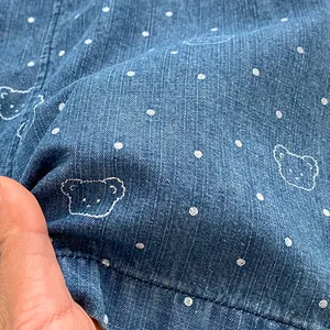 Infant denim overalls featuring cute bear embroidery and white polka dot patterns