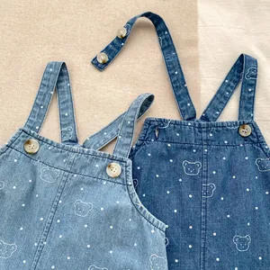 Baby denim overalls with cute bear embroidery and polka dot patterns in blue denim colors