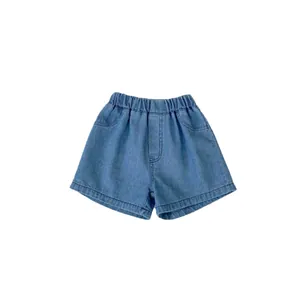 Girls light blue denim shorts with elastic waist and lace details in minimalist style