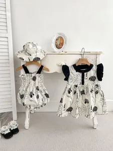 Detailed look at baby floral bodysuit and matching dress set in French vintage style