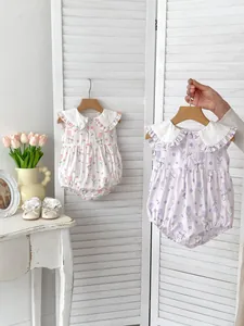 Detail of infant sleeveless bodysuits with bunny tulip print and lace collar