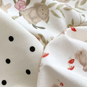 Baby sleeveless bodysuit featuring cute rabbit, mushroom, and polka dot patterns