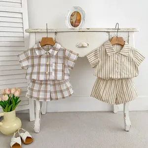 Detail of plaid and striped summer cotton linen shirt sets for baby boys
