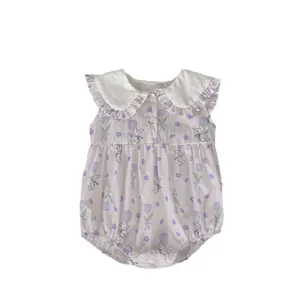 Baby rabbit print romper with white ruffle collar and floral tulip pattern flat lay view