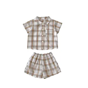 Boys summer plaid two-piece set featuring short sleeve button shirt and matching shorts