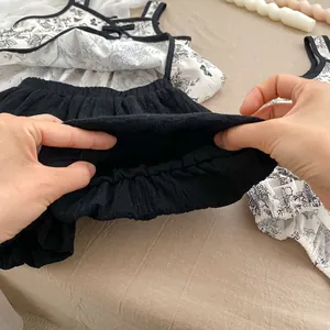 Detail showing the elastic waistband of baby floral bloomers with high stretch comfort
