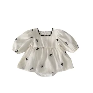 White long-sleeve baby girl bodysuit with bow print and mesh princess puff sleeves