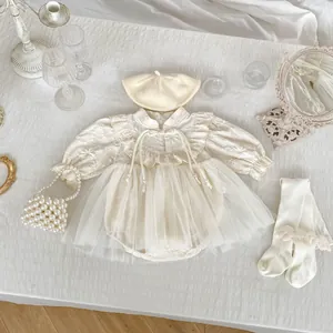 Flat lay of baby girl tutu romper set with knitted beret and pearl handbag accessories