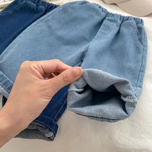 Loose fit kids denim pants in light and dark blue wash with elastic waistband