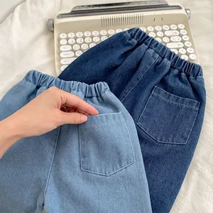Relaxed fit kids denim trousers with elastic waistband and back pockets in blue tones
