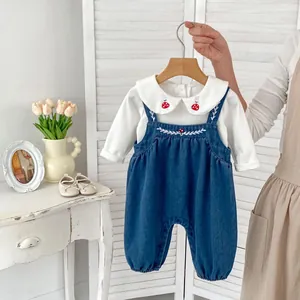 Infant 2-piece set with white embroidered shirt and denim mushroom overalls for spring