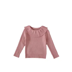 Pink knit sweater for girls featuring a large ruffle collar and soft ribbed texture