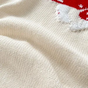 Infant mushroom knit romper in off-white with cozy long sleeves and holiday pattern