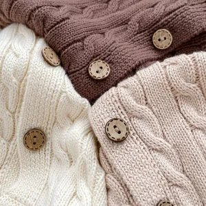 Retro kids cotton cable knit cardigan with vintage wooden buttons in earthy tones