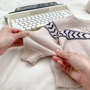 Knitted beige sweater for boys with navy blue geometric patterns and high elasticity