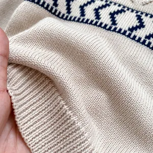 Beige knit sweater for toddler boys featuring navy geometric patterns and ribbed textures
