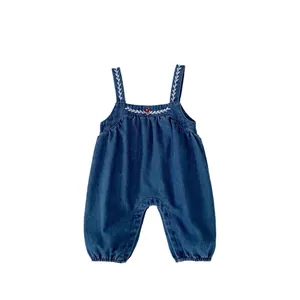 Infant dark blue denim romper with white leaf embroidery and red mushroom detail
