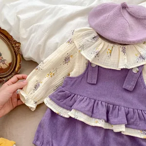 Detail of floral shirt and purple corduroy suspender romper with a matching beret hat