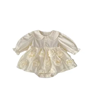 Long-sleeved baby romper dress in cream white with 3D floral appliqués and Peter Pan collar