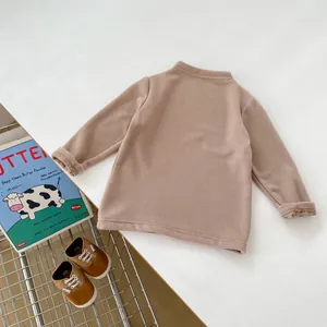 Detail view of khaki thermal undershirt showing soft fabric texture and crew neckline