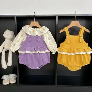 Detail of infant corduroy rompers with ruffle trim and floral long sleeve shirts