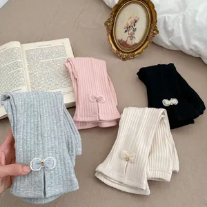 Pantaloni a zampa elasticizzati da bambina in quattro colori con fiocco laterale