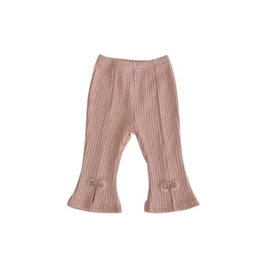 Pantaloni a zampa rosa a coste per bambine con fiocchi e orli a spacco per l'autunno