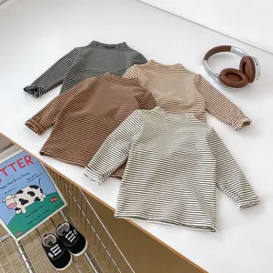 Flat lay detail of striped long sleeve cotton shirts for toddlers in four classic colors