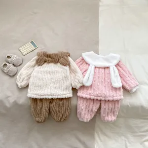 Cozy cartoon coral fleece pajama sets for babies in white-brown and pink-white color schemes