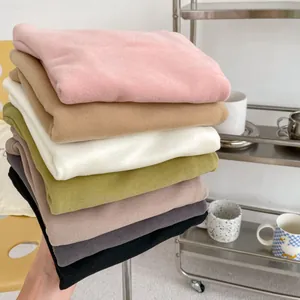 Close-up of soft thermal velvet baby shirts in seven colors for autumn and winter