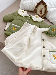 Detail of embroidered floral collar and quilted fleece lining on baby winter jackets
