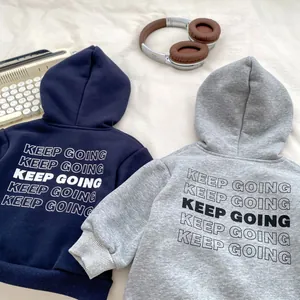 Hooded sweatshirts for boys in navy and grey featuring 'KEEP GOING' print on the back