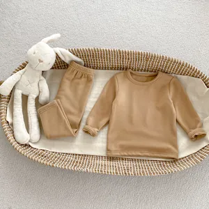 Detail of infant ginger velvet thermal set in camel brown with a soft knit texture