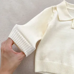 Three-piece baby boy knit polo sweater and overall set in elegant creamy white color