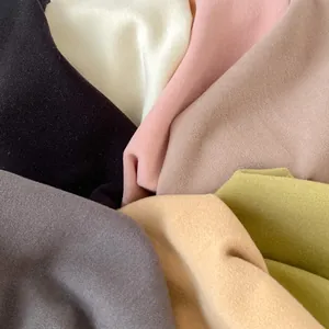 Close-up of soft thermal fleece fabric layers in multiple colors for children set