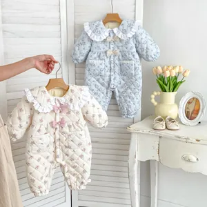 Floral quilted baby romper with lace collar and bow detailing for cold weather