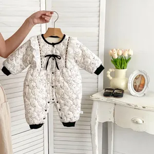 Quilted baby floral romper with black bows and lace details for autumn and winter