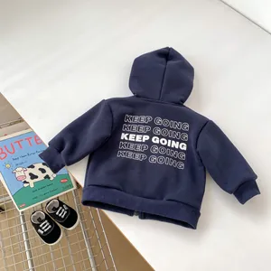 Detail of navy blue fleece hoodie with white Keep Going letter print and ribbed cuffs