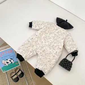 Quilted floral baby romper with ribbed cuffs and matching black beret styling accessories