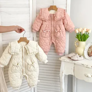 Detail of baby winter romper showing ruffled collar with delicate floral embroidery